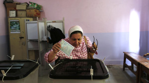 An Egyptian casts her vote during the first round of Egyptian parliamentary elections, at a polling station in Alexandria, Egypt, Sunday, Oct. 18, 2015. (AP Photo/Hassan Ammar)